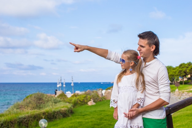 Happy young father and his adorable little daughter outdoors