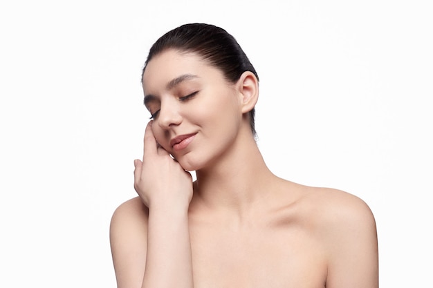 Happy young female against a white background