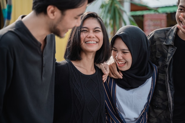 Happy young friends laughing together