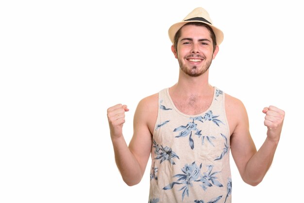 Happy young handsome bearded tourist man ready for vacation