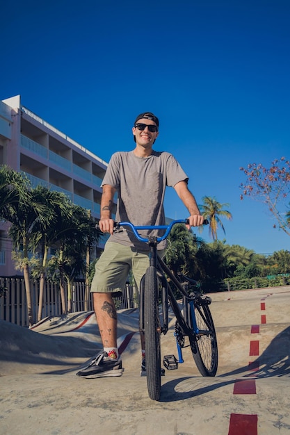 Happy young man enjoy bmx riding at the skatepark