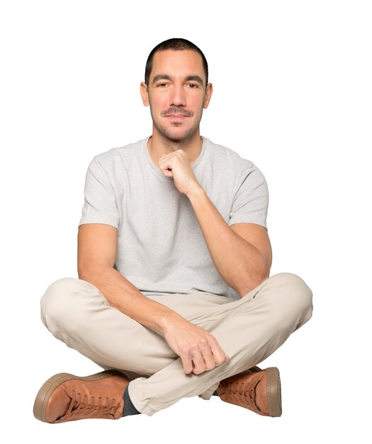 Happy young man posing against background