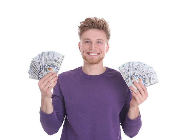 Happy young man with money on white background