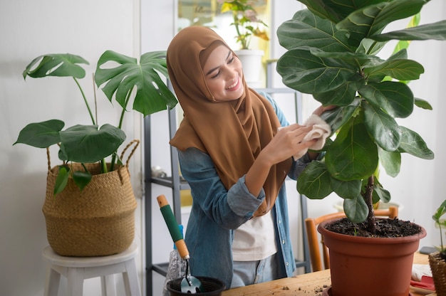 A happy young muslim woman enjoying  and relaxing leisure activity in garden at home