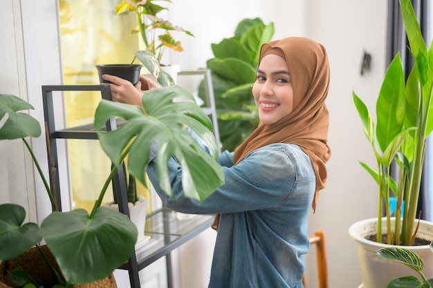 A happy young muslim woman enjoying  and relaxing leisure activity in garden at home