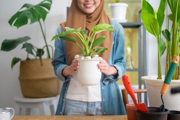 A happy young muslim woman enjoying  and relaxing leisure activity in garden at home