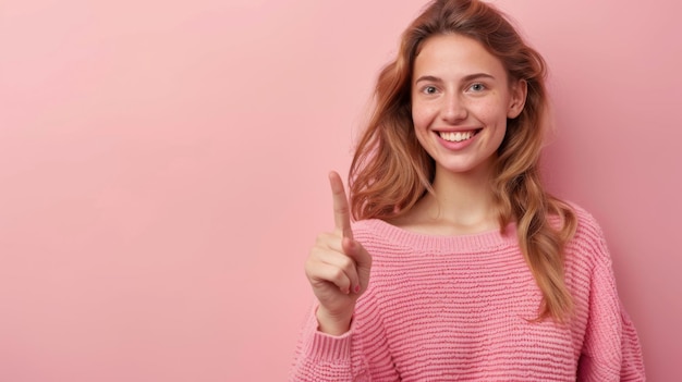 Photo happy young smiling woman wearing looking at camera pointing finger away at copy space showing aside