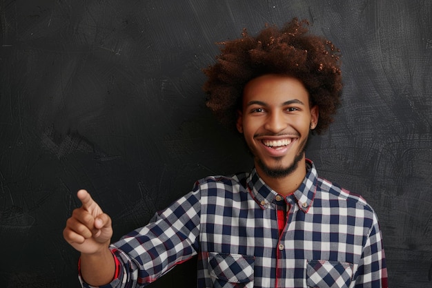 Happy young student with afro hair pointing and smiling