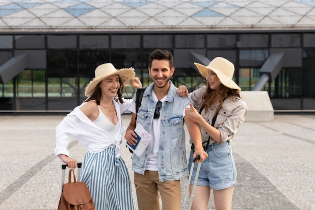 Happy, young tourists at the train station