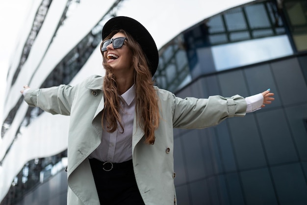 Happy young woman architect on the background of a freshly built building