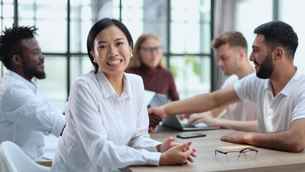 Happy young woman and looking at the camera Portrait of a smiling businesswoman