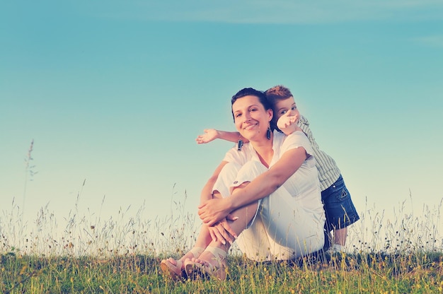 happy young woman mother play and outdoor with beautiful child