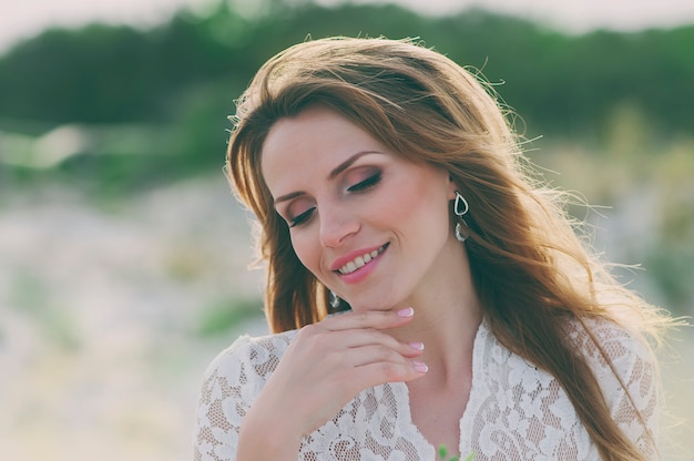 Happy young woman in wedding dress