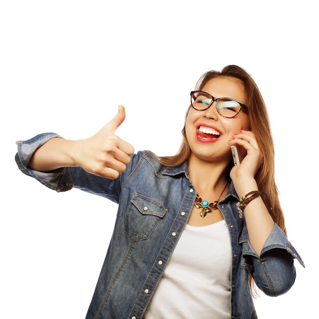 Happy young woman with smartphone