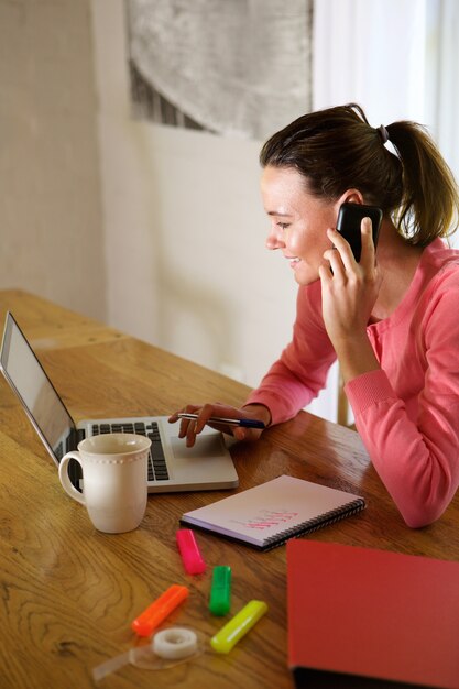 Happy young woman working from home