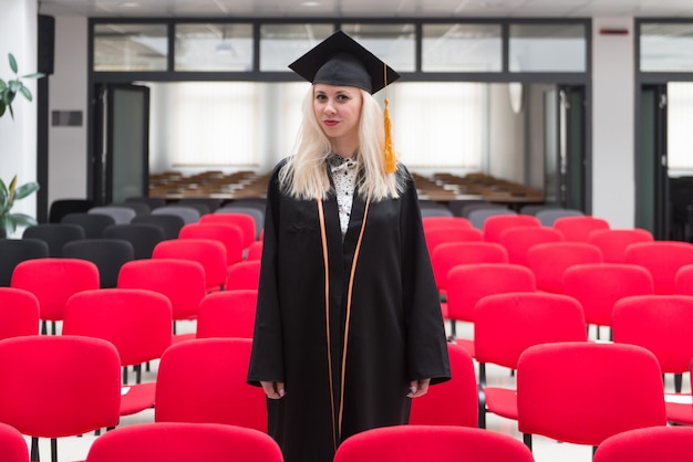 Happy Young Women in Robe at College Degree