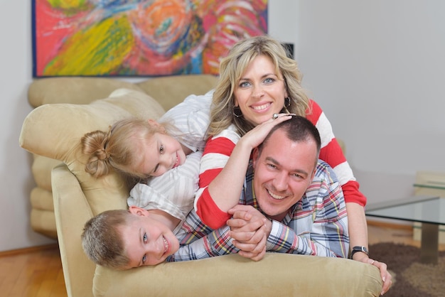 hapy young family have fun  with their children at modern living room home indoors