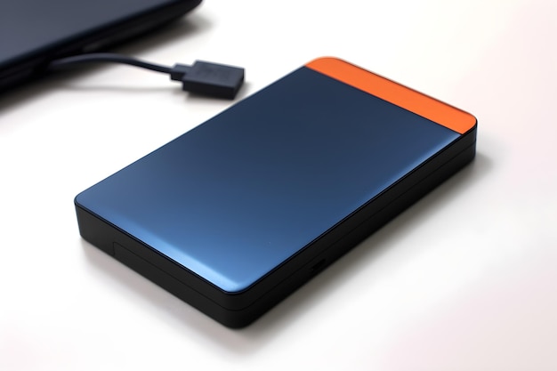 A hard drive with an orange top and a black bottom.