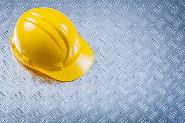 Hard hat on corrugated metal sheet construction concept