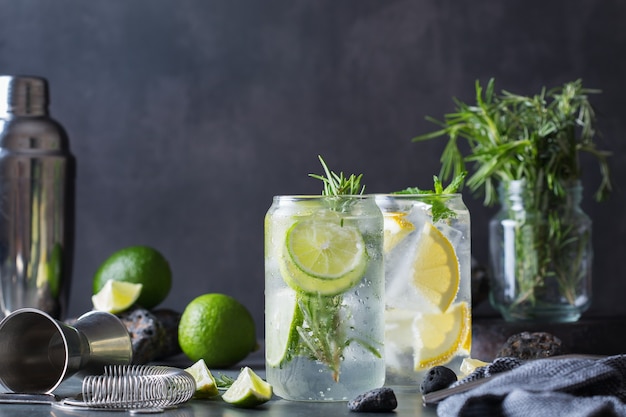 Hard seltzer cocktails with lime and lemon on a table. Summer refreshing beverage, drink