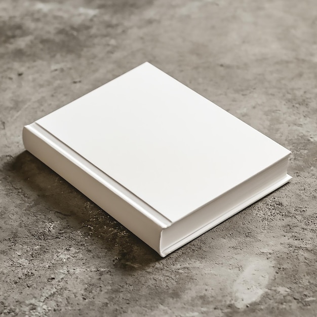 Photo hardcover book mockup on gray concrete table with white cover for design presentation