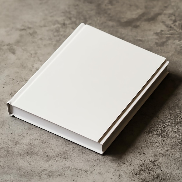 Photo hardcover book mockup on gray concrete table with white cover for design presentation