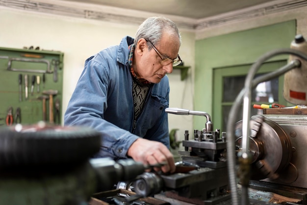 Hardworking man doing his job in an industrial workshop