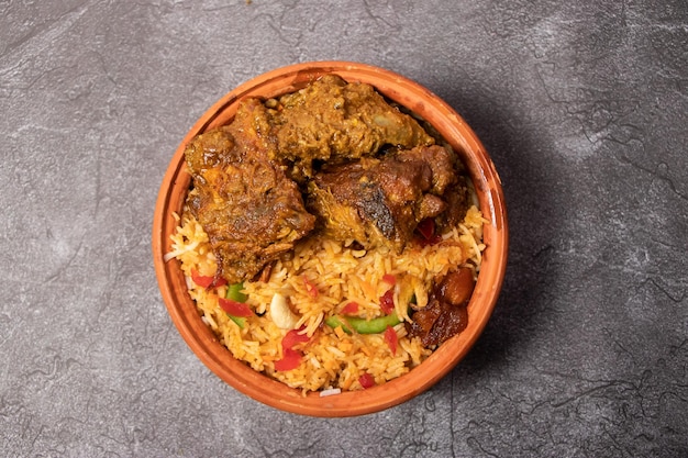 Hari chicken Biriyani or green meat biryani rice served in dish isolated on background top view of bangladesh food