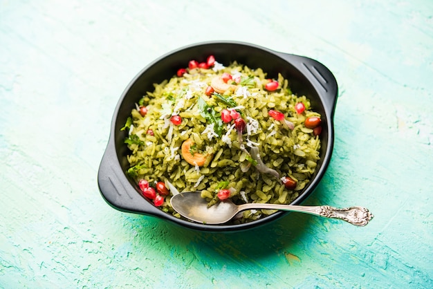 Hariyali Poha, Green Masala Pohe or flattened rice served in a bowl, selective focus