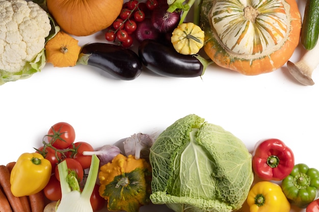 Harvest of many vegetables isolated on white background border frame with copy space for text