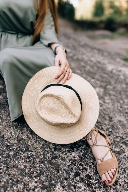 A hat in a girlâs hand. Ð¡lose-up