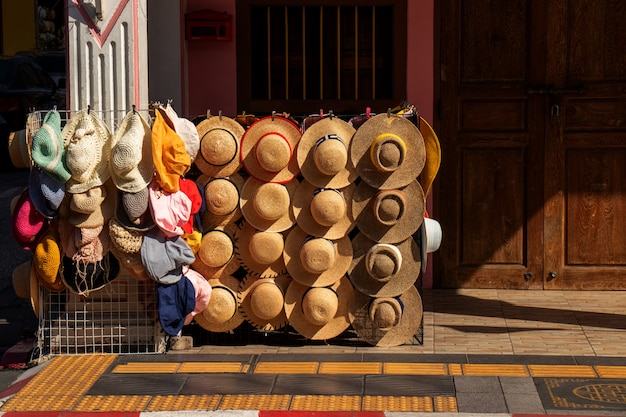 Hat shop for selling on sidewalk in the touristic town at Phuket, Thailand