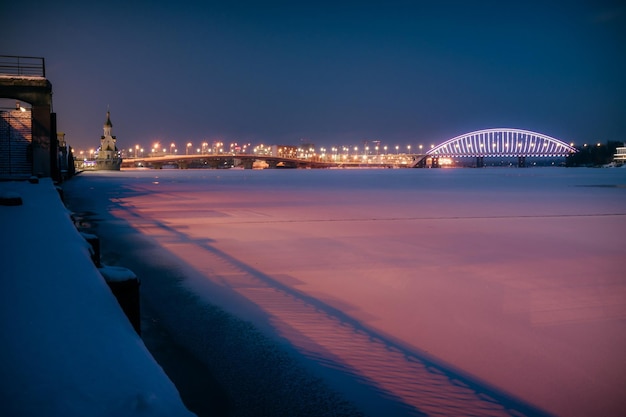 Havana bridge and Podilskyi Bridge in Kyiv at winter night with colorful illumination