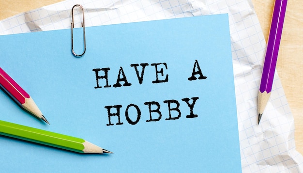 HAVE A HOBBY text written on a paper with pencils in office