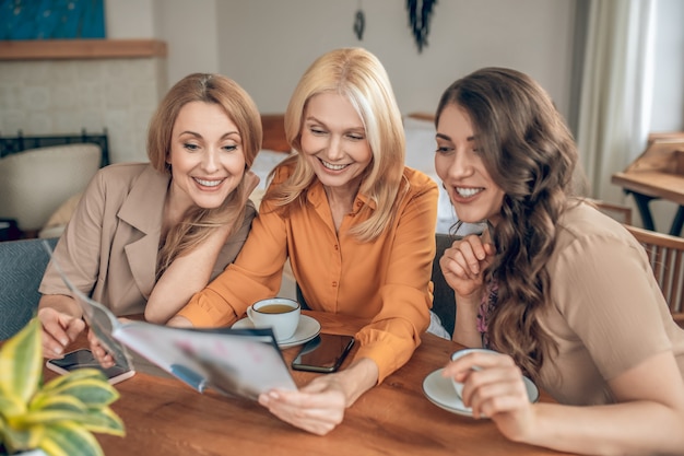 Having good time. Group of women spending time together and feeling excited