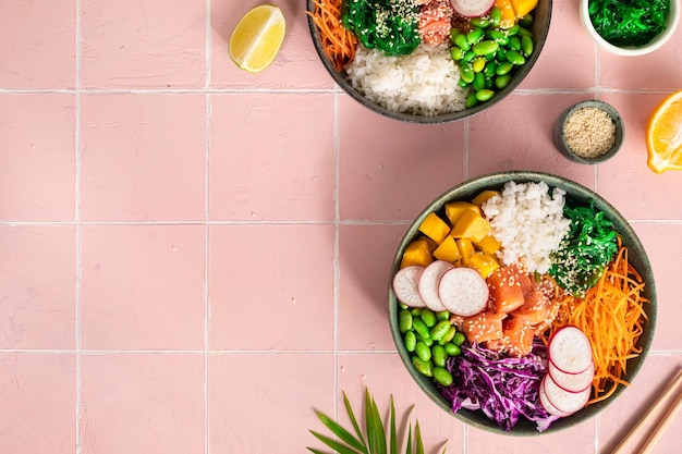 Hawaiian poke bowl with salmon in a bowl with seaweed sesame seeds and cabbage Top view flat layer copy space