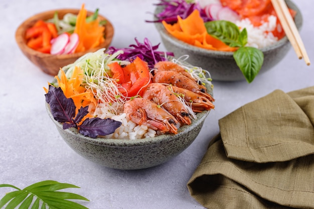 Hawaiian poke bowl with salmon and shrimps