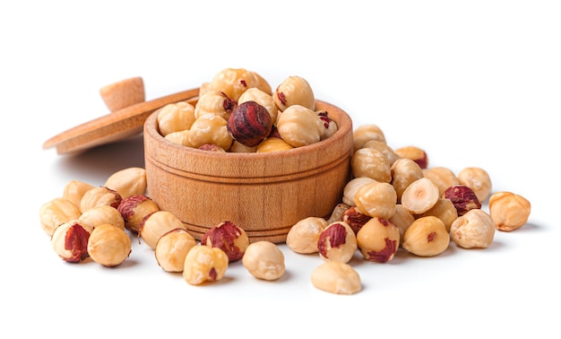 Hazelnuts peeled from the shell on a white background