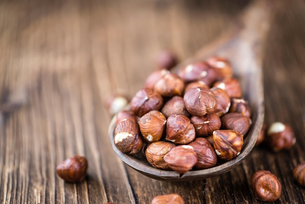 Hazelnuts on vintage wooden background selective focus