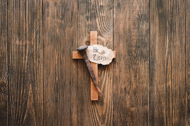 He is Risen Jesus Crown Thorns and nails and cross on a wood background Crucifixion Of Jesus Christ Passion Of Jesus Christ Concept for faith spirituality and religion Easter Day