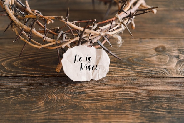 He is Risen Jesus Crown Thorns and nails and cross on a wood background Crucifixion Of Jesus Christ Passion Of Jesus Christ Concept for faith spirituality and religion Easter Day