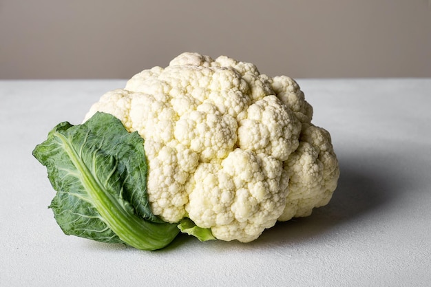 Head of cauliflower lies on surface