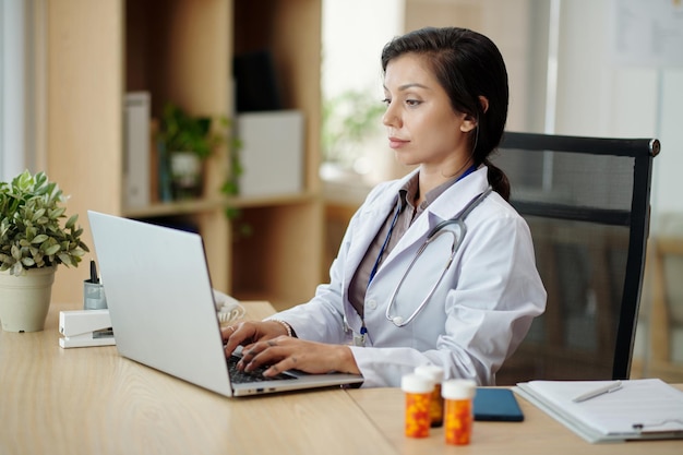 Head of Clinic Working Laptop