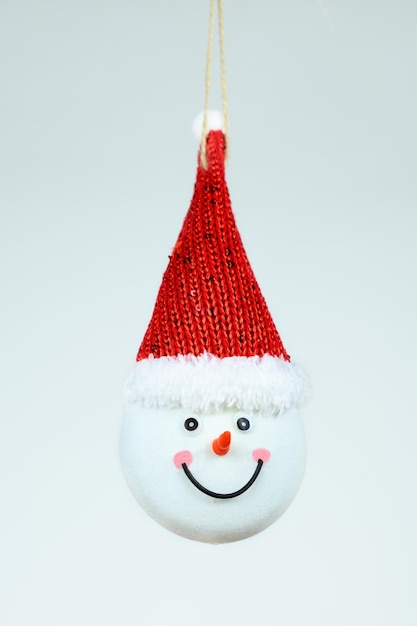 Head of a happy snowman on white background christmas tree decoration