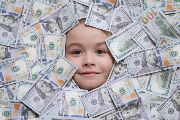 Head in money fun kid face on dollars money shopping and financial concept