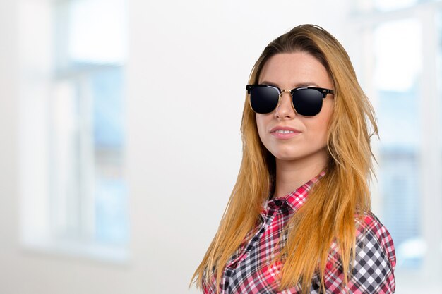 Head shot of woman wearing sunglasses