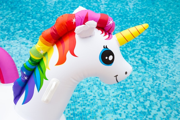 Head of unicorn swim tube on swimming pool 