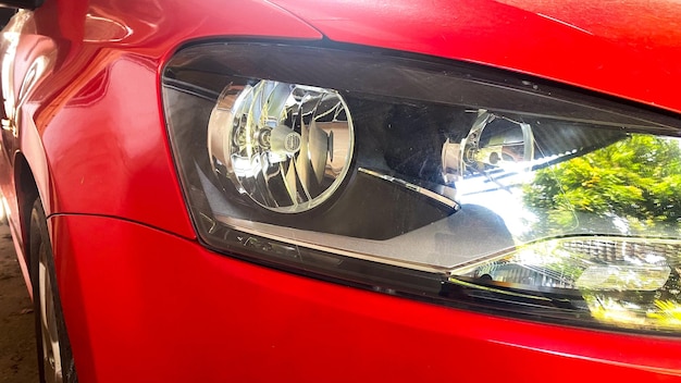 headlamp of a red car