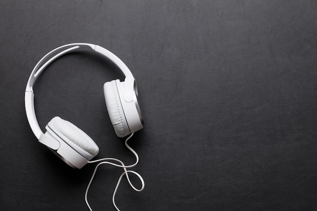 Headphones on leather desk table