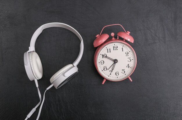 Headphones with alarm clock on chalk board